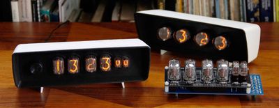 A nixie tube clock in a 3D-printed case.
