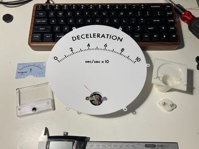 Big meter dial with small meter components installed in it.