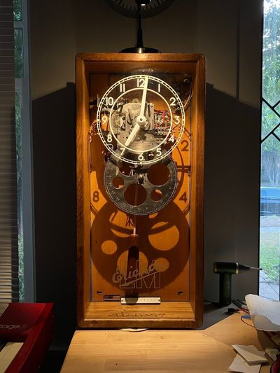 Full clock under dramatic lighting.