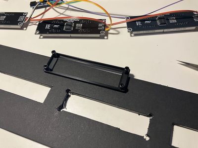 Plastic bezels for the digital displays.