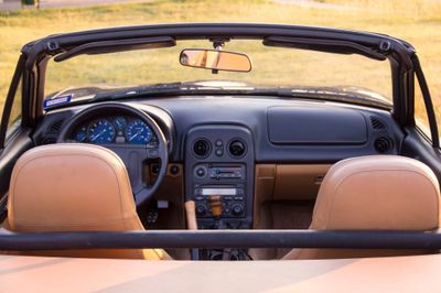 Wide shot from the back of the car and above, like you'd see in a car sales ad.