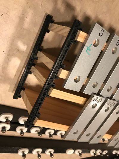 3D-printed test fitter for the spacing of the rails.