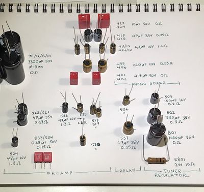 New capacitors arranged on a sheet of paper with labels written next to each.