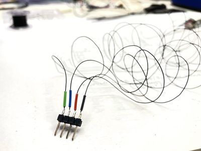 Staggered, stripped wire ends prepared for soldering to the motor board.