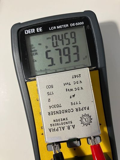 LCR meter showing 5.793uF measurement on a nominal 2uF condenser.